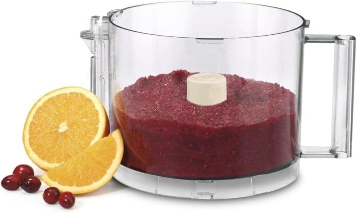 orange and cranberries in cuisinart container