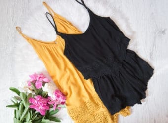 Orange and black romper, peonies on white fur Fashionable concept