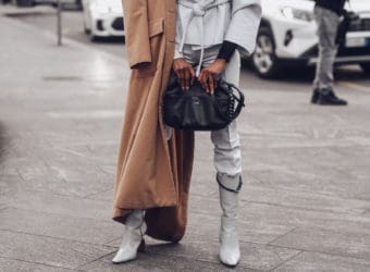 Crop stylish woman with bag on street