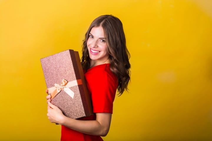 Beautiful woman with a gift box